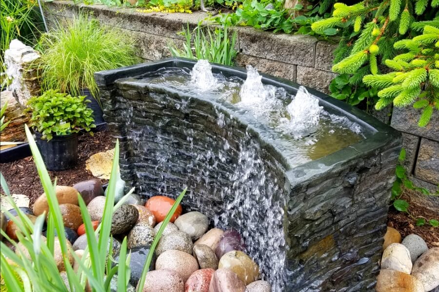 Landscape design ideas with bubbling water feature